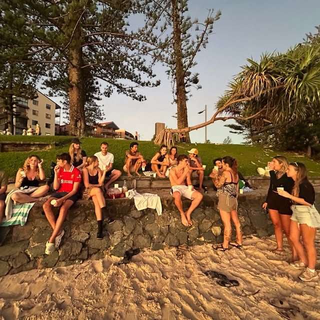 Golden hour beach hangout at CALI Backpackers
