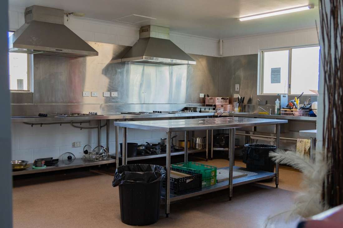 Fully equipped communal kitchen at CALI Backpackers